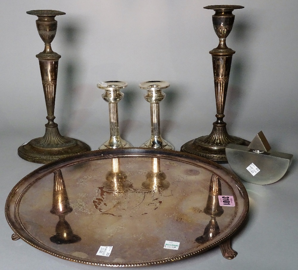 A pair of modern silver table candlesticks, marked 925, 15cm high, a pair of plated candlesticks,