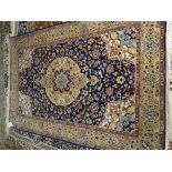 An indigo rug, the indigo field with central medallion, 191cm x 124cm.