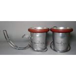 'Mercier', a pair of modern stainless steel champagne buckets with table holders,