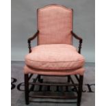 A 19th century and later stained pine child's open armchair with pink upholstery,