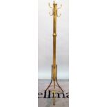 An early 20th century brass coat stand on three outswept supports, 177cm high.