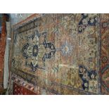 A Tabriz carpet, the madder field with large medallion, 320cm x 161cm.