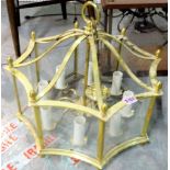 A set of five gilt metal and glass wall lights, 34cm tall, and an octagonal glazed ceiling light,