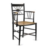 An ebonised open armchair with cane seat and faux bamboo supports, 52cm wide.