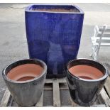 A modern large square garden pot, 65cm wide x 91cm high, and a smaller pair of garden pots,