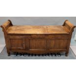 An 18th century single oak window seat with a single drawer over a cupboard base,