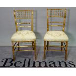 A pair of early 20th century gold painted faux bamboo side chairs, 42cm wide x 85cm high, (2).