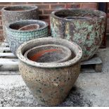 A quantity of modern garden pots of various sizes, the largest being 57cm wide x 50cm high (12).