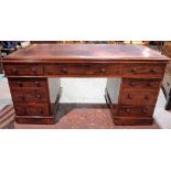 An Edwardian mahogany pedestal desk with nine drawers about the knee and tooled leather top,
