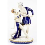 A Royal Dux figure group depicting dancers in blue, 33cm tall.