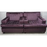 A pair of modern purple upholstered square back armchairs, on tapering ebonised supports,