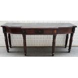 A William IV mahogany serving table, the marble top over three frieze drawers on reeded supports,
