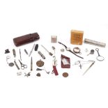 A small group of collectables, including; a leather cigar case, a small magnifying lens,