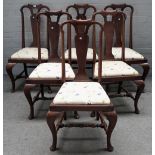 A set of six 19th century walnut vase back dining chairs, of Queen Anne design on pad feet. (6).