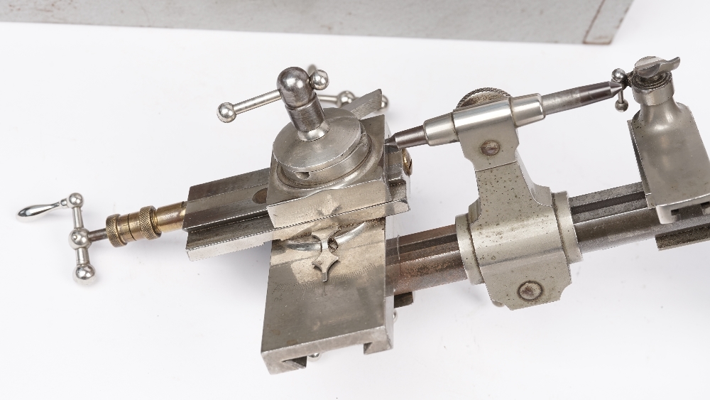 A Horologists steel lathe, a die set and related horological accessories. - Image 5 of 5