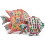 A modern polychrome painted sheet metal hanging lantern, in the form of a fish, and another similar,