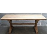 A 17th century style stripped oak plank top refectory table on 'X' frame supports,