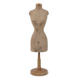 A tailor's table top dummy, early 20th century, female form with textile torso on a beech wood base,