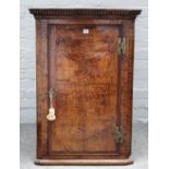 A George III oak and pollard oak wall hanging corner cabinet,