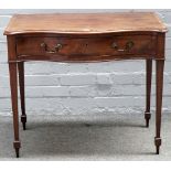 A George III inlaid mahogany, serpentine single drawer writing desk, on tapering square supports,