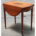 A George III tulip wood banded satinwood oval Pembroke table with bow frieze drawer on tapering