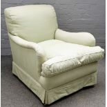 A Howard style 20th century easy armchair, on tapering square mahogany supports,