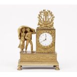 A 19th century gilt bronze figural mantel clock with two children hiding under a blanket and floral