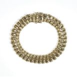 A 9ct gold decorated and plain multiple link bracelet, on a snap clasp, weight 26.6 gms.