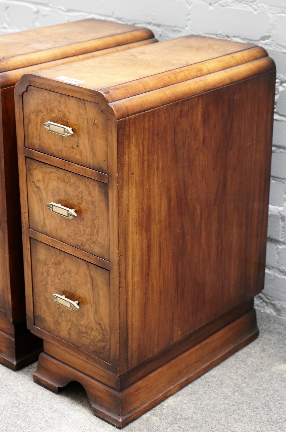 A pair of 1930s walnut three drawer bedside tables, on bracket feet, 27cm wide x 69cm high. - Image 2 of 3