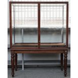 A pair of large 19th century mahogany rectangular museum display cases, on turned supports,