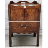 An 18th century mahogany tray top commode, with a pair of cupboards over a pull out,