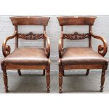 A pair of early Victorian style mahogany carver chairs, with carved waist rail on reeded supports,