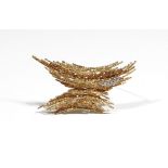 A Grima 18ct gold and diamond brooch, in a curved abstract design,