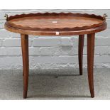 A George III mahogany oval serving tray with wavey gallery on later stand, 73cm wide x 53cm high.