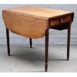 A Regency mahogany Pembroke table, with end frieze drawer on tapering reeded supports,