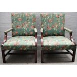 A pair of George III style mahogany framed Gainsborough style armchairs,