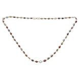 A precious yellow metal and coloured gemstone set necklace, of graduated design,