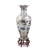 A large modern Chinese vase of baluster form, gilt blue decorated with exotic birds and flowers,