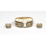 A Michaela Frey Wien gilt metal and enamelled hinged bangle from the Hommage à Gustav Klimt range,