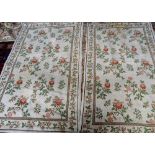 A pair of modern cross stitch decorative Portuguese rugs,