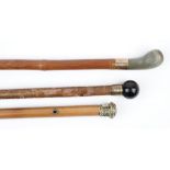 An early 20th century walking cane with spherical tiger's eye pommel, 73cm,