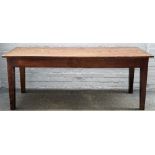 An 18th century and later oak plank top kitchen table, on tapering square supports,