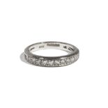 An 18ct white gold and diamond-set half-hoop eternity ring, set with eleven circular-cut diamonds,