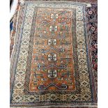 A Perepedil rug, Caucasion, the madder field with five ivory medallions and six ram's horns,