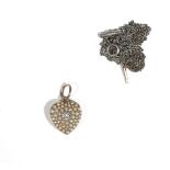 A diamond and seed pearl-set yellow precious metal pendant locket of heart design,
