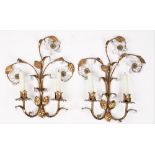 A pair of modern gilt metal two branch wall sconces, each foliate cast and hung with crystal drops,