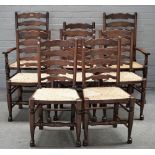 A set of eight stained beech Lancashire ladder back rush seat chairs, to include a pair of carvers,