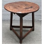 A late 18th/early 19th century elm and oak cricket table, with perimeter stretcher,