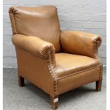 A mid-20th century child's brown leatherette upholstered club armchair, on block supports,