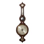 A Victorian rosewood wheel barometer with dry/damp detector thermometer, bulls eye mirror,